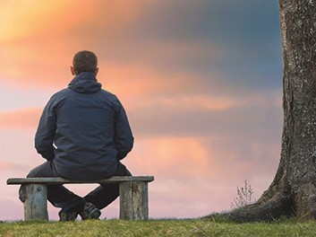 Man sitting on a wooden bench