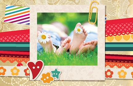 A page from a scrapbook, photo of people's feet in the grass with added embellishments