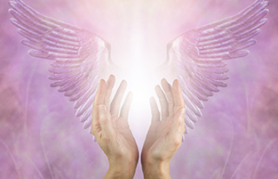 Two hands cupped around a bright light with angel wings